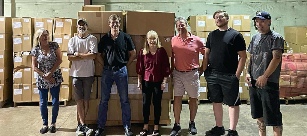 The Stegmann team helping Soles4Souls in the warehouse.