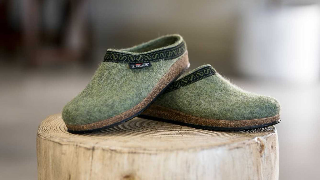 The The Original 108 Clog - Sage colorway sitting on a log as part of the new fall 2022 shoes, boots, clogs and more from Stegmann.