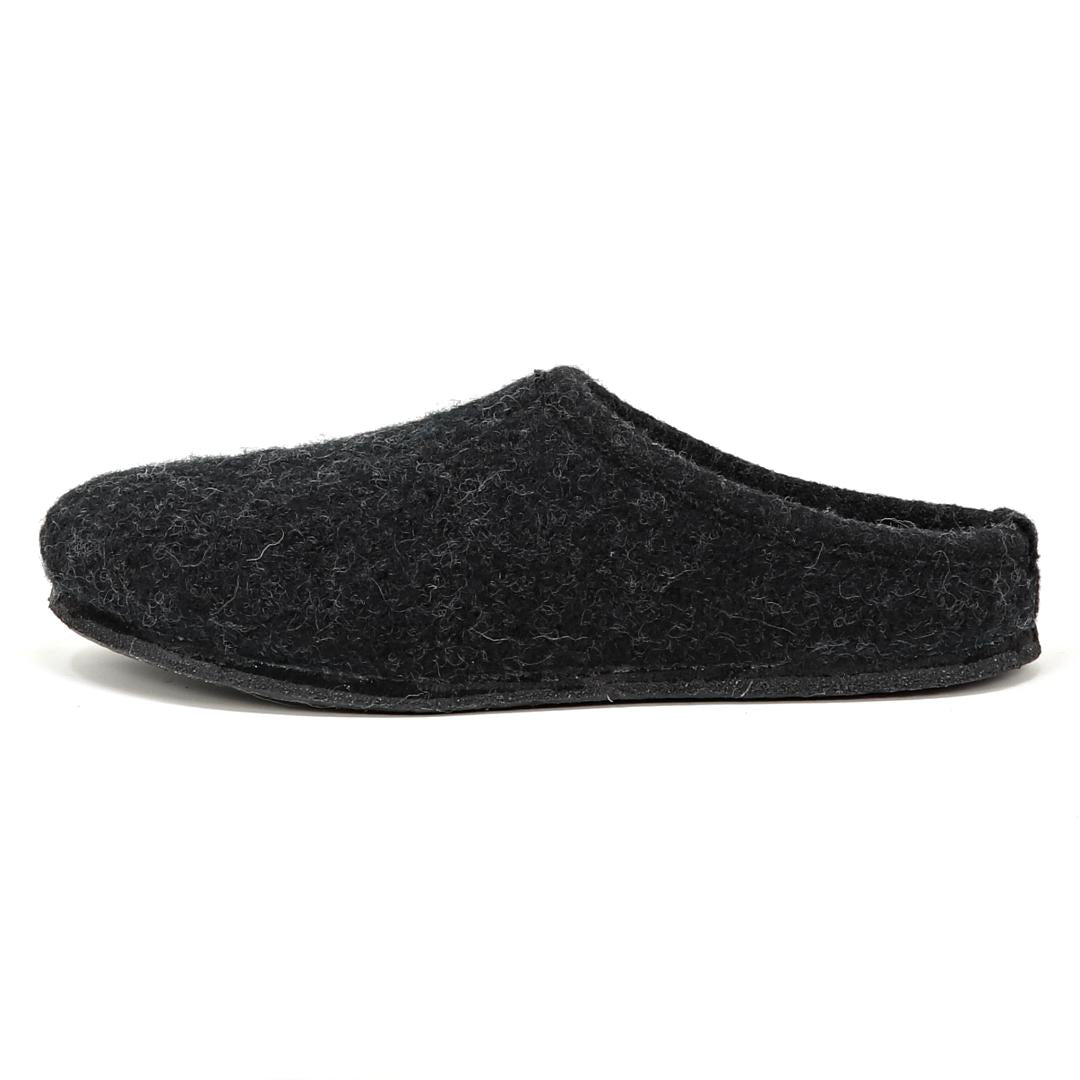 A Men's Alpine Comfort Wool Slipper in black, featuring fuzzy Merino wool, an open back, and an anatomically shaped cork insole, showcased on a plain white background.