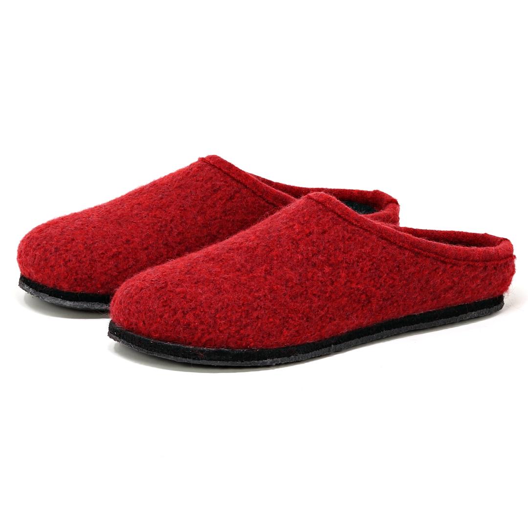 The Women's Alpine Comfort Wool Slipper is a red pair made from soft merino wool with durable black soles.
