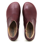 A pair of Women's Leather Amalia Boots in burgundy, viewed from above, with "Stegmann" branding visible on the insoles.