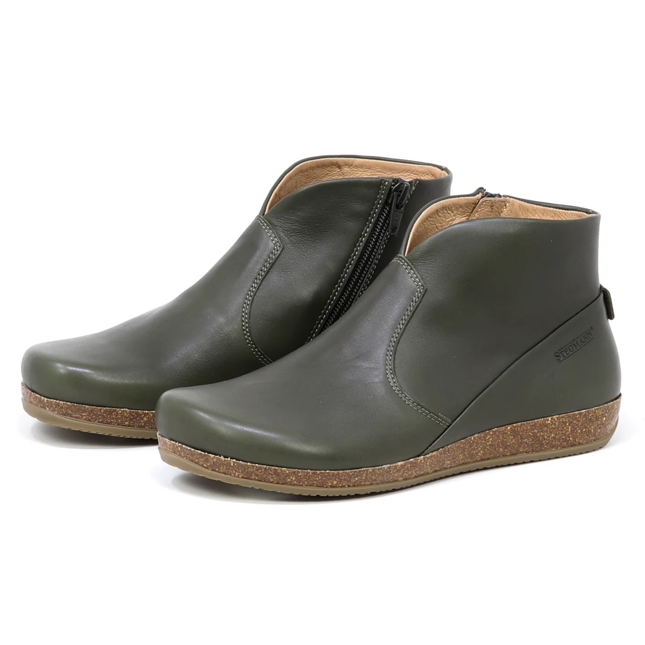 The Women's Leather Amalia Boot features olive green leather uppers, side zippers, and cork soles, displayed against a white background.