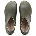 Top view of a pair of olive green Women's Leather Amalia Boot slip-ons with Stegmann branding visible on the insoles.