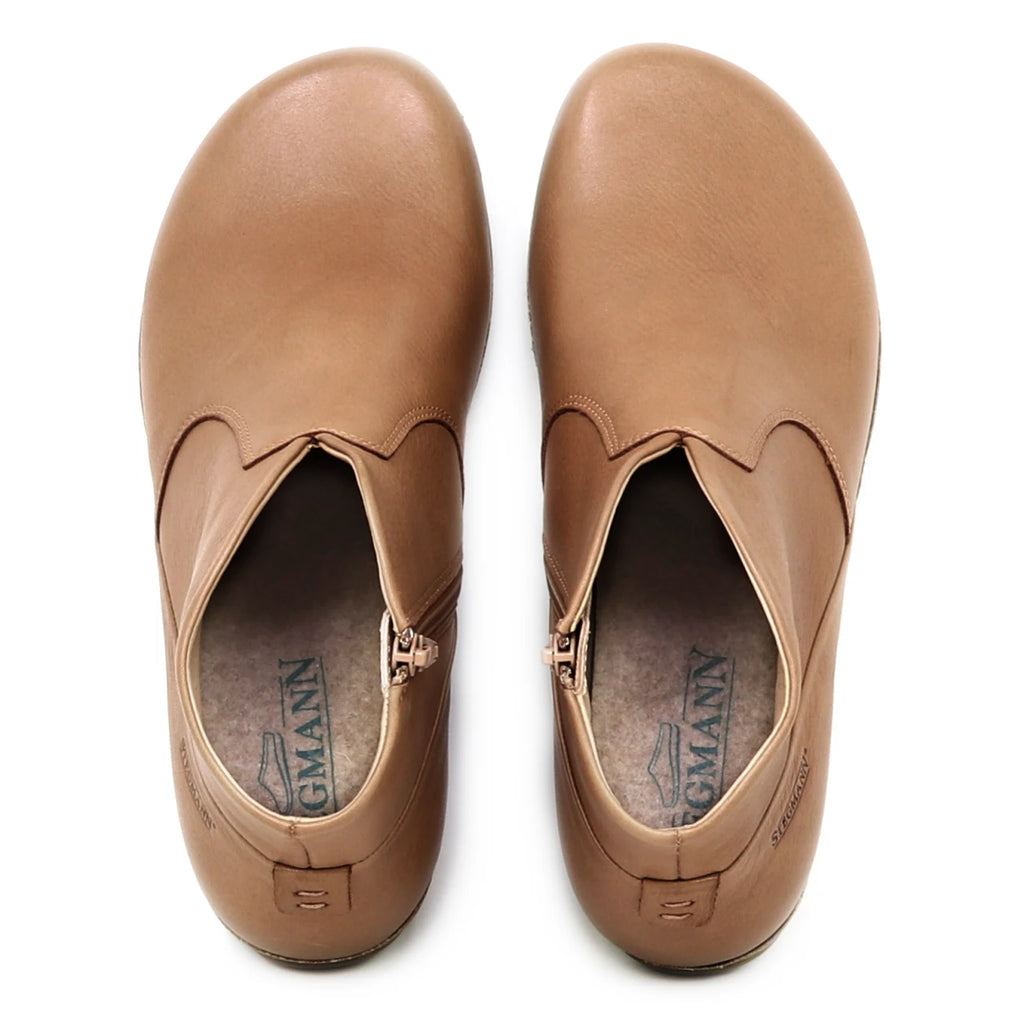 A pair of tan Women's Leather Amalia Boots viewed from above, showing the insoles with the "Sagmann" brand logo.