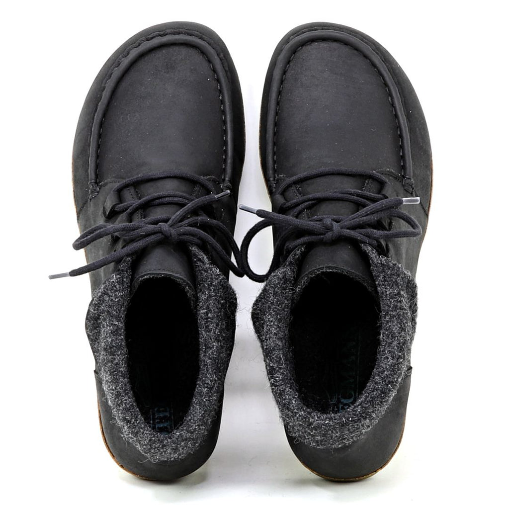 The Women's Baden Leather Boot is a pair of black leather shoes with laces, featuring gray fabric detailing around the ankles and an ultra-cushioned support insole for added comfort, viewed from above.