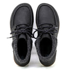 The Women's Baden Leather Boot is a pair of black leather shoes with laces, featuring gray fabric detailing around the ankles and an ultra-cushioned support insole for added comfort, viewed from above.