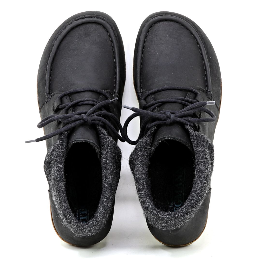 The Women's Baden Leather Boot is a pair of black leather shoes with laces, featuring gray fabric detailing around the ankles and an ultra-cushioned support insole for added comfort, viewed from above.