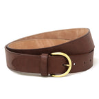 A Women’s Matching Leather Belt in brown, crafted from full grain leather and featuring a gold-toned buckle, is shown coiled on a white background, offering a classic and elegant accessory for women.