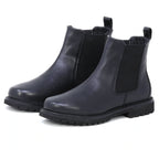 A pair of Women’s Brenner Chelsea Boots in black lightweight leather, featuring elastic side panels and pull tabs, displayed on a white background.