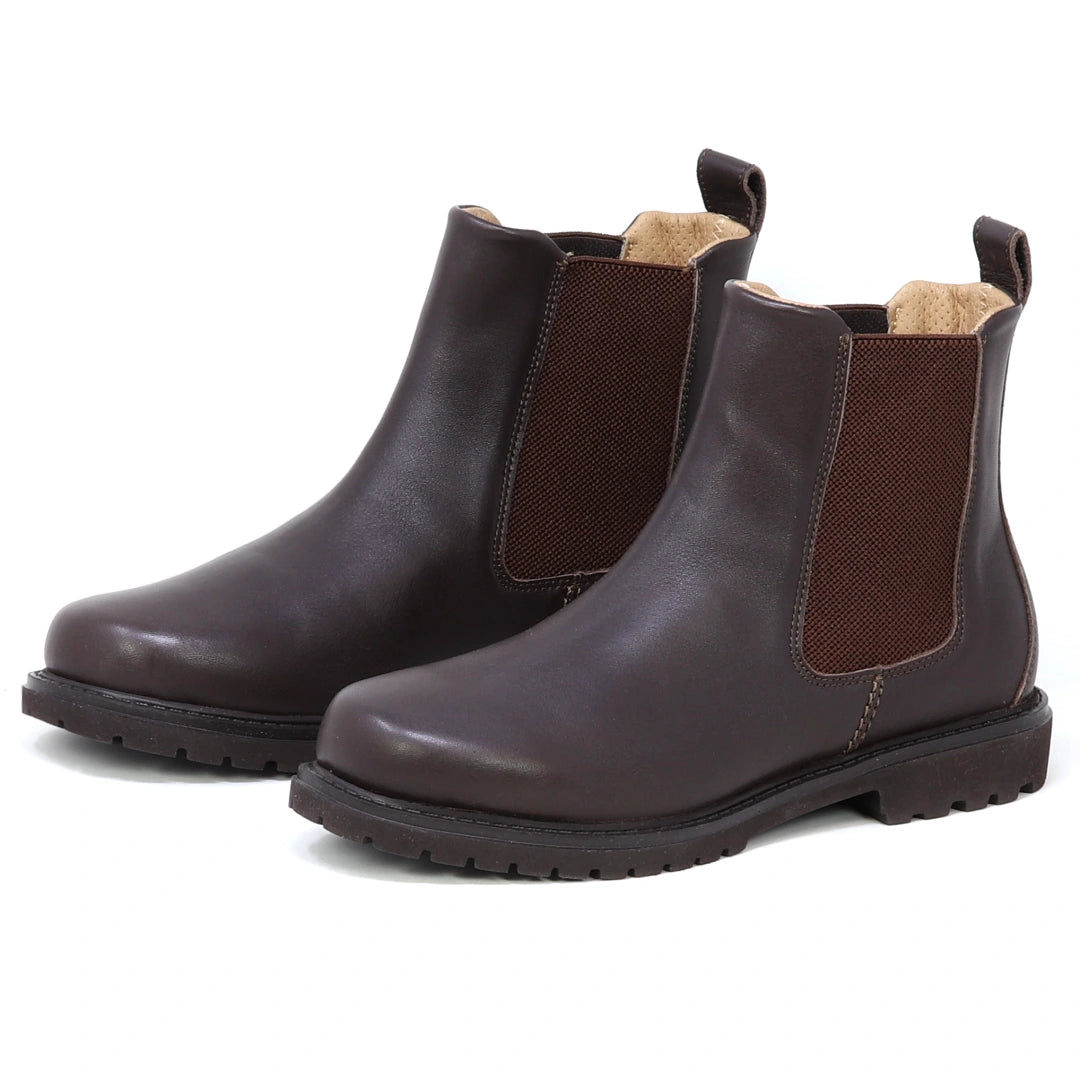 A pair of Women’s Brenner Chelsea Boots in dark brown, ultra-light and waterproof, crafted from premium Portuguese leather with elastic side panels, pull tabs, and black rubber soles, displayed on a white background.