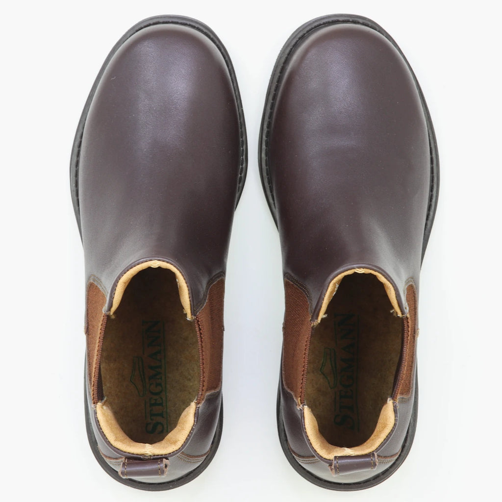 A pair of Women’s Brenner Chelsea Boots in brown lightweight leather are shown from above on a white background.