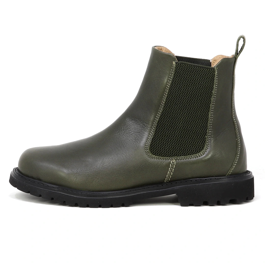 The Women’s Brenner Chelsea Boot is shown in profile on a white background—a single olive green waterproof Chelsea boot featuring a black elastic side panel, back pull tab, and a black lug sole, crafted from premium Portuguese leather.