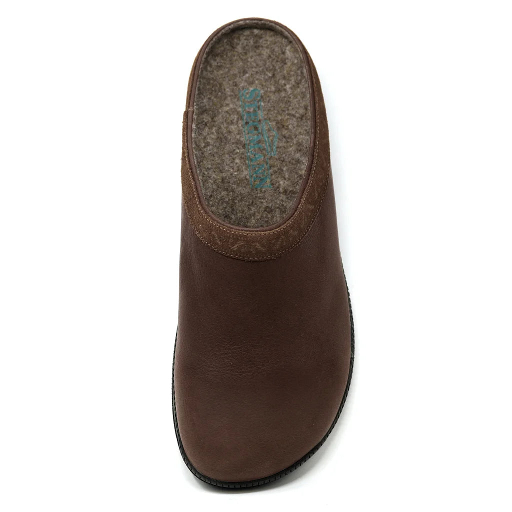The Men's Graz Leather Clog with Sport Sole is a brown slip-on with a closed toe, wool felt insole, and black recycled rubber sole, shown from above.
