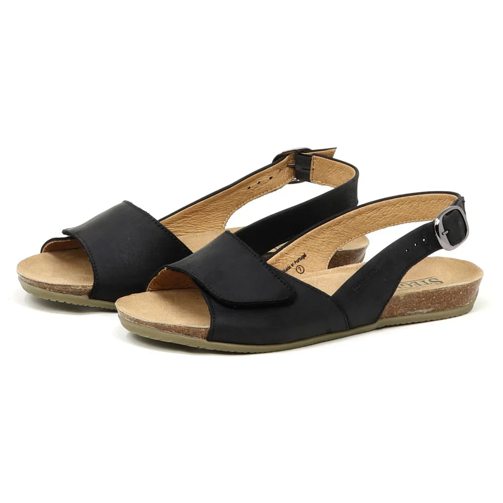 Women's Clara Slingback Sandal features black leather open-toe design, adjustable ankle straps, cork soles, and a cushioned footbed for comfort and style on a white background.