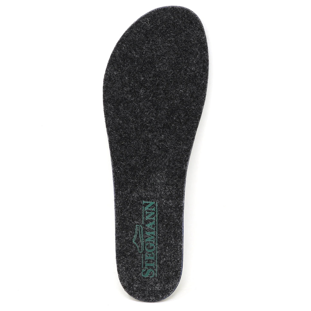 A single Women’s Wool Contour Plus+ Replacement Insole w/ Arch in gray felt, featuring the “STEGMANN” brand name printed in green near the heel, displayed on a white background and designed to provide enhanced arch support for all-day comfort.