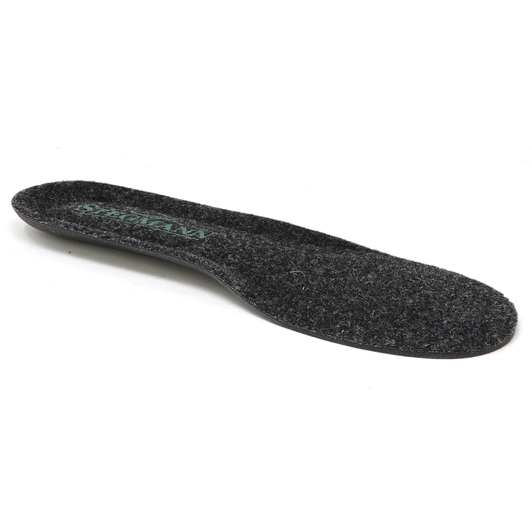 A single Women’s Wool Cushion Replacement Insole - No Arch, made of black felt material, designed for Stegmann shoes, is displayed on a white background.