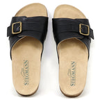 The Women's Ella Slide Sandal features black leather straps with buckles and tan contoured cork footbeds, branded with "Stegmann.