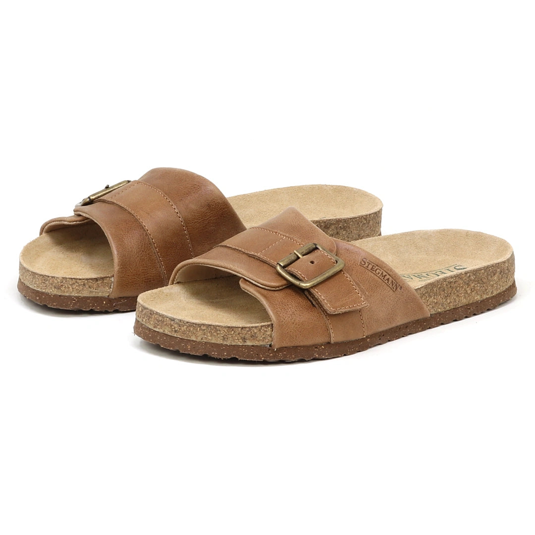 The Women's Ella Slide Sandal features brown leather straps, a contoured cork footbed, and adjustable metal buckles, displayed on a white background.