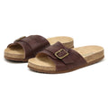 The Women's Ella Slide Sandal, shown on a white background, features a brown slip-on design with adjustable leather straps and a contoured cork footbed.