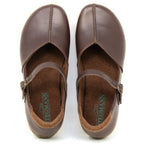 The Women's Eva Leather Mary-Jane features brown vegetable-tanned leather, buckle straps, and visible brand logos on the EVA insoles.