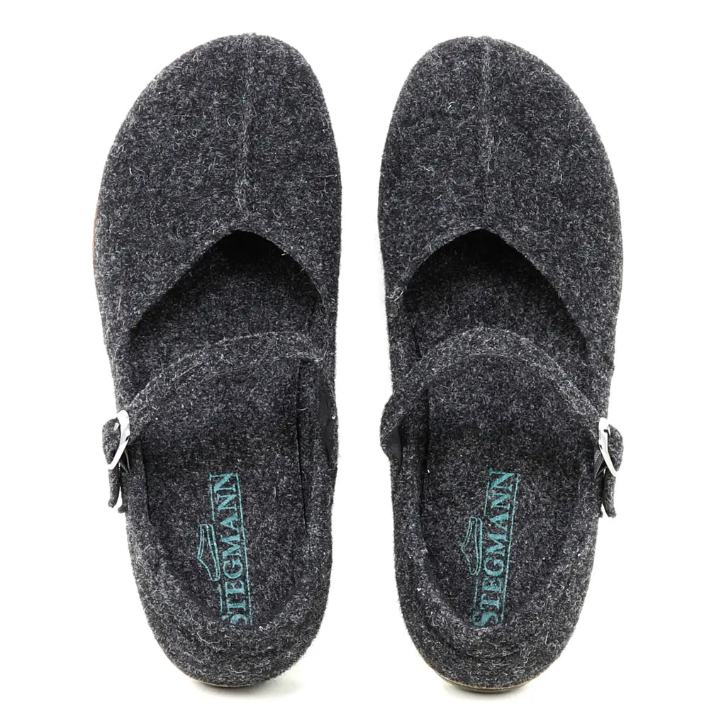 A pair of Women's Eva Wool Mary-Jane slip-on clogs in dark grey felt with buckled straps and a wide toe box for extra comfort, viewed from above. Insoles are branded "Stegmann.