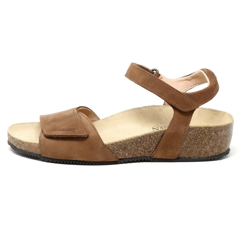Women's Freya Leather Wedge Sandal in brown, featuring an ankle strap with Velcro closure, a cork footbed, and a textured black sole with a recycled rubber traction outsole.