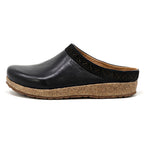 Discover the Women's Graz Leather Clog, a black slip-on crafted from vegetable-tanned leather with a cork sole and delicate embroidered trim. Its bunion-friendly design ensures comfort without compromising elegance.
