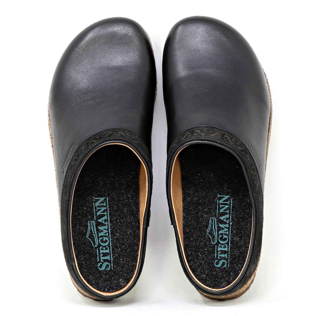 Pair of bunion-friendly Women's Graz Leather black clogs on a white background, viewed from above.
