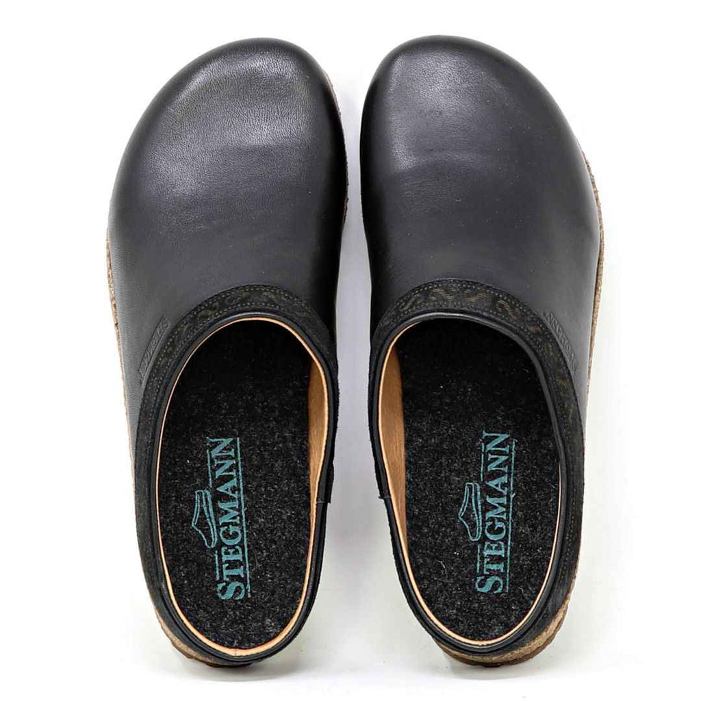 Pair of bunion-friendly Women's Graz Leather black clogs on a white background, viewed from above.