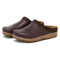 The Women's Graz Leather Clogs feature vegetable-tanned leather in rich brown, cork soles, and dark patterned trim. Their design ensures style and comfort for bunions, presented elegantly against a crisp white backdrop.