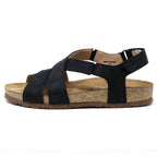 The Women's Hannah Leather Sandal - Medium is a black strappy sandal with a cork sole, displayed in a side view on a white background. It includes a cushioned suede footbed and arch support, combining style and comfort.