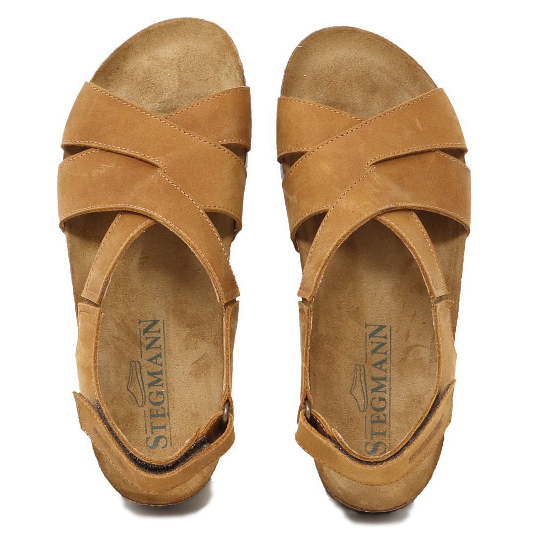 Try the Women's Hannah Leather Sandal - Medium: brown leather with crisscross straps, adjustable back straps, and a cushioned suede footbed for top comfort. Featuring the "Stegmann" label on insoles, these sandals provide excellent arch support for all-day wear.