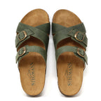 A pair of "Women's Heidi Leather Sandal - Medium" in green with adjustable straps, brown buckles on a white background, featuring an ultra-cushy footbed and the "Stegmann" logo on the insoles.