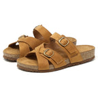 The Women's Heidi Leather Sandal - Medium features brown leather, an ultra-cushy footbed, cork soles, and two adjustable straps with gold buckles.
