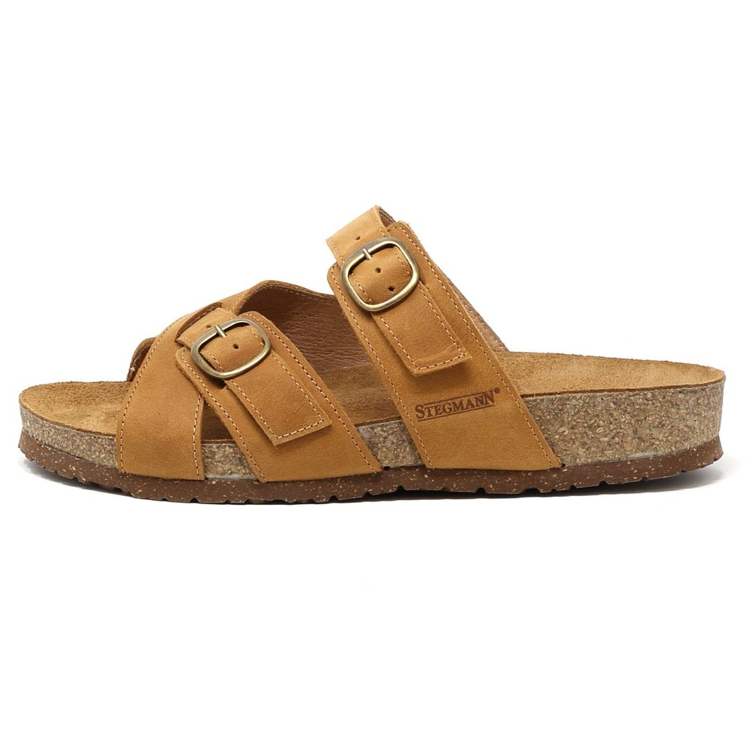 The Women's Heidi Leather Sandal - Medium features a tan leather design with an ultra-cushy footbed, two adjustable straps, a sustainable cork midsole, and the Stegmann logo on the side.