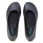 The Women's Helene Ballet Flat is a black leather shoe with rounded toes, seen from above. Each features a grey insole with blue Tegmann branding and subtle arch support for comfort.