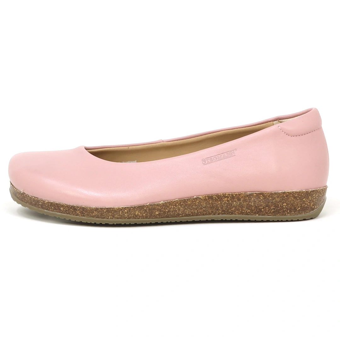 The Women's Helene Stretch Leather Ballet Flat features pink stretch leather, a rounded toe, and a cork-textured sole—designed from the side view to be bunion friendly for extra comfort.