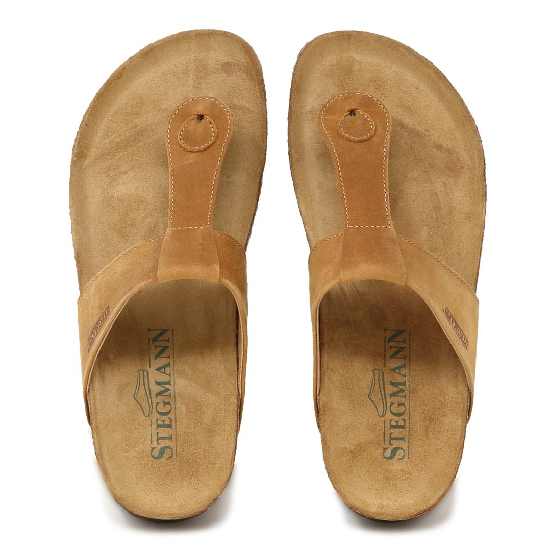 Explore the Women's Inga Leather Sandal by "Stegmann," showcasing a brown leather thong design with a sustainable cork footbed for optimal comfort. Combining style and eco-consciousness, these sandals feature a timeless design akin to the well-known Birkenstock Gizeh.