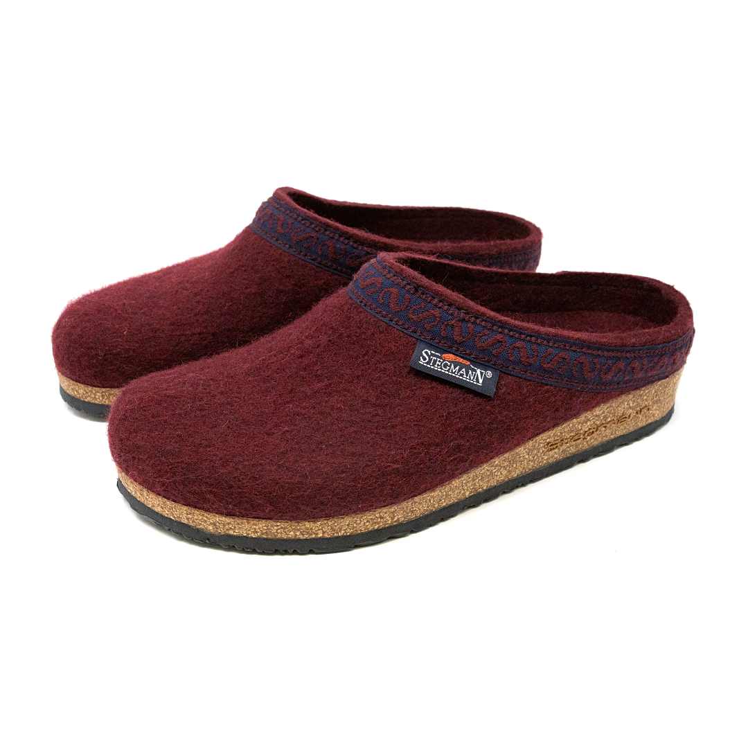 The Women's Original 108 Wool Clog - Medium features burgundy Merino wool, cork soles, black trim, and a Stegmann label—offering women a stylish and supportive orthopedic shoe choice.