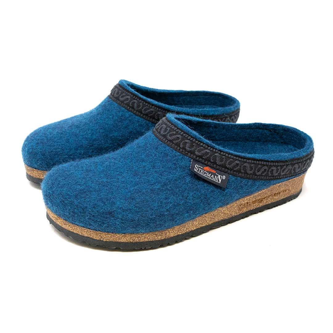 The Women's Original 108 Wool Clog - Medium features blue Merino wool felt, black patterned trim, cork soles, and a Stegmann label—crafted for comfort and ideal for plantar fasciitis relief.