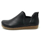 The Women's Lieben Leather Chelsea Boot is a black slip-on with a cork sole, elastic side panels, visible white stitching, and a cozy wool felt lining for comfort.