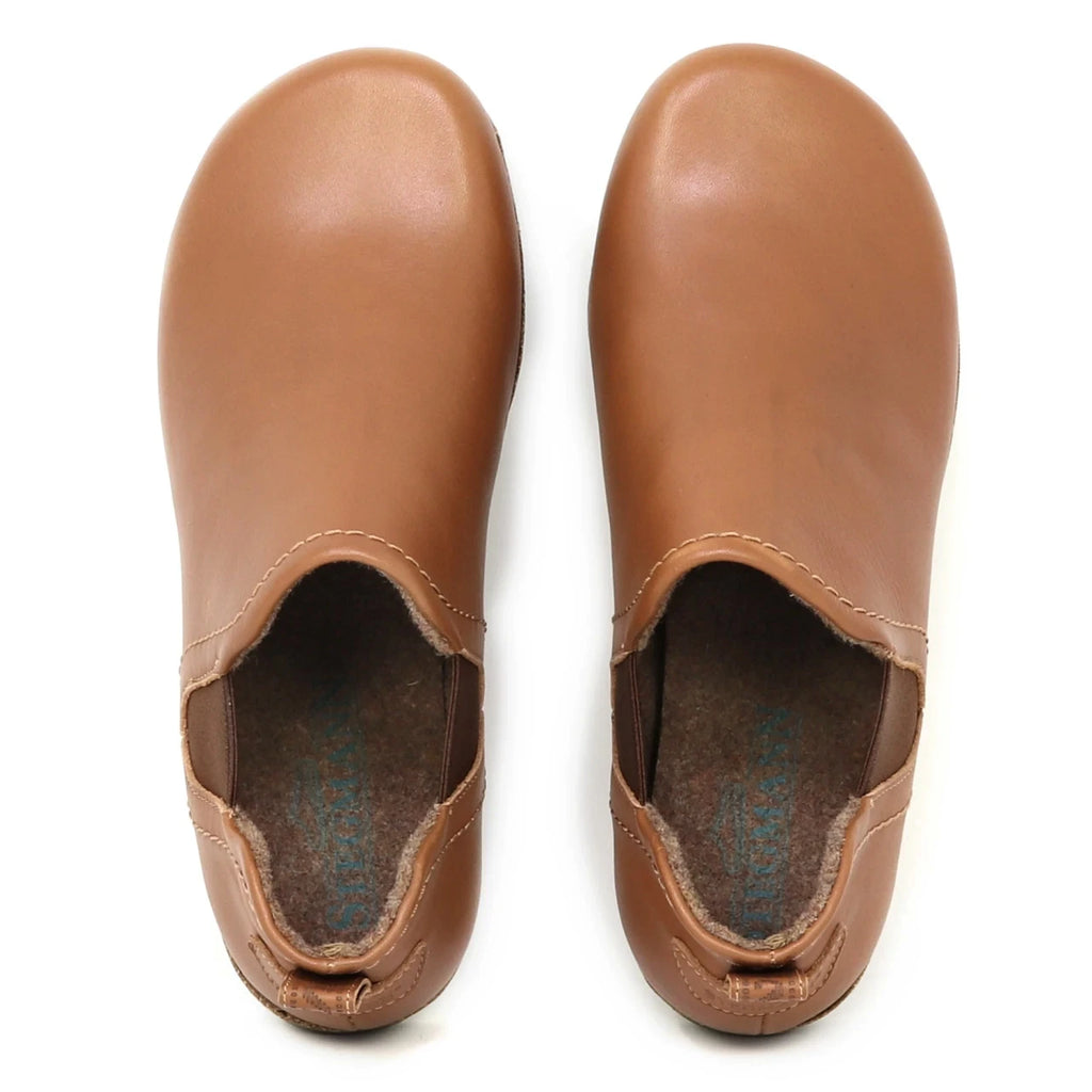 The Women's Lieben Leather Chelsea Boot is shown in tan vegetable-tanned leather with rounded toes, viewed from above against a white background.