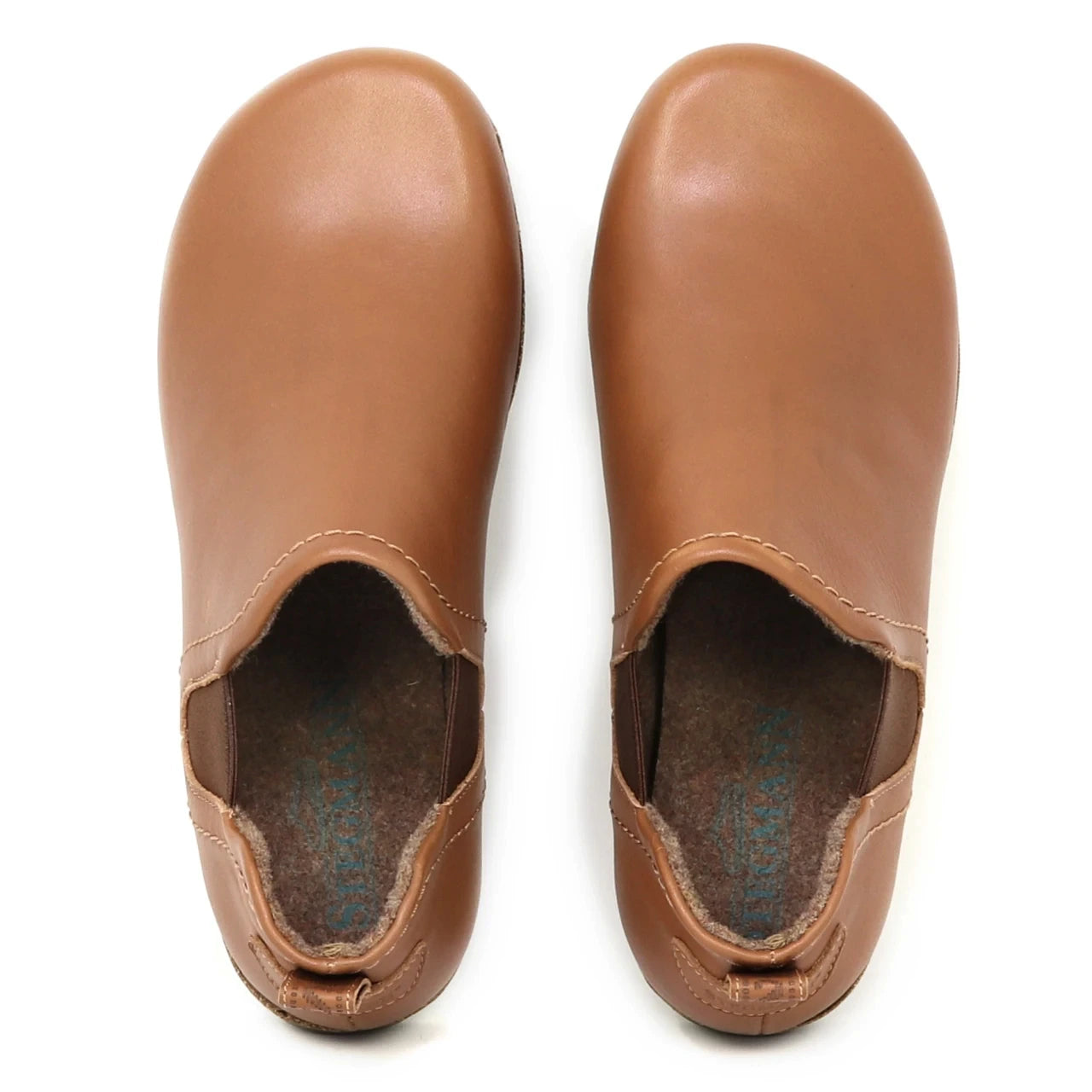 The Women's Lieben Leather Chelsea Boot is shown in tan vegetable-tanned leather with rounded toes, viewed from above against a white background.