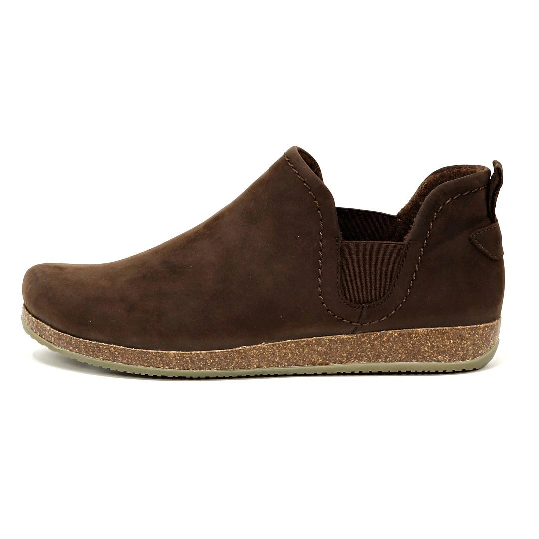 The Women's Lieben Leather Chelsea Boot features a rounded toe, elastic side panel, pull tab at the heel, and textured rubber sole, all crafted from vegetable tanned leather in brown.