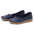 Women’s Liesl Leather Skimmer in navy blue, featuring a slip-on design with cork soles, arch support, and a wide toe box, displayed on a white background.