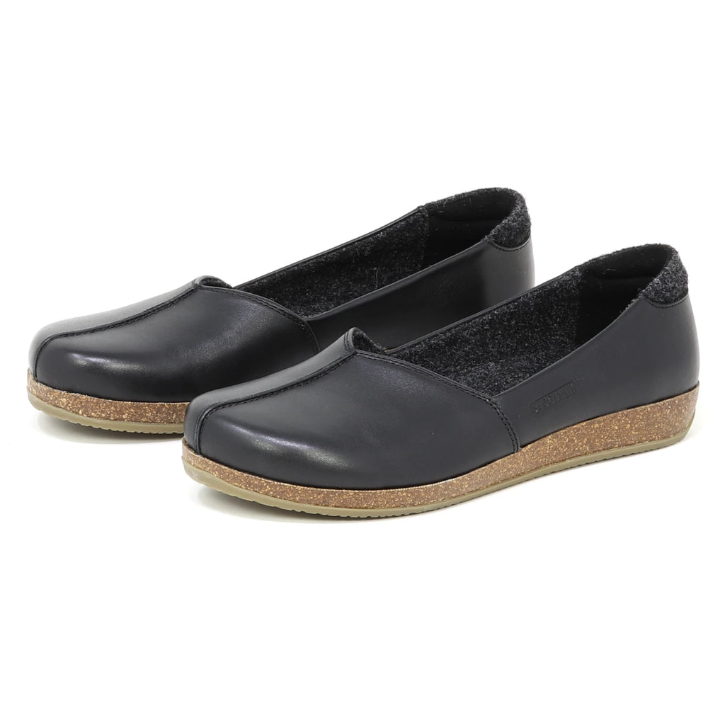 The Women's Liesl Leather Skimmer features black slip-on style, a wide toe box, cork soles, and a simple design, shown on a plain white background.