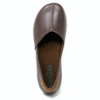 A top view of the Women's Liesl Leather Skimmer, a brown leather shoe with a center seam, wide toe box, and visible insole labeled "EL NATURALISTA.