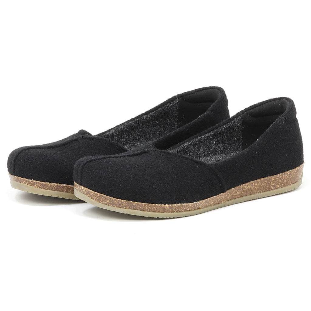 The Women's Liesl Wool Skimmer, black slip-on flats with cork-look soles and a wide toe box for comfort, are displayed on a white background.