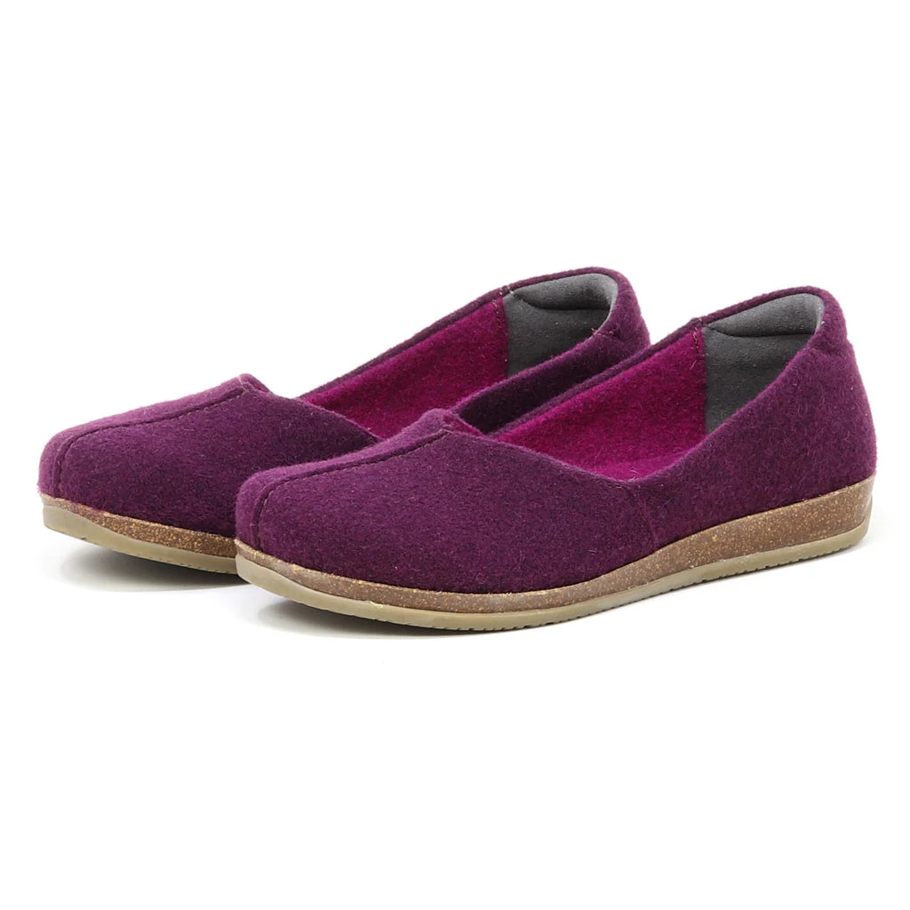 The Women's Liesl Wool Skimmer is a pair of purple wool shoes for women, featuring a wide toe box and tan rubber soles, displayed against a white background.