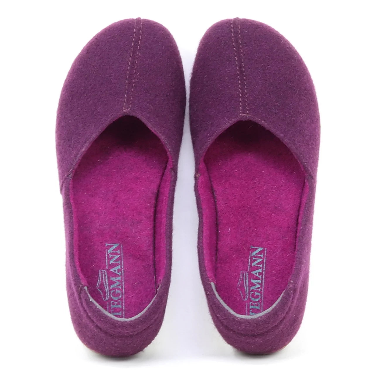 The Women's Liesl Wool Skimmer in purple felt features a wide toe box, visible stitching, and "Stegmann" insoles; this pair of women's slip-on wool shoes is shown from above.